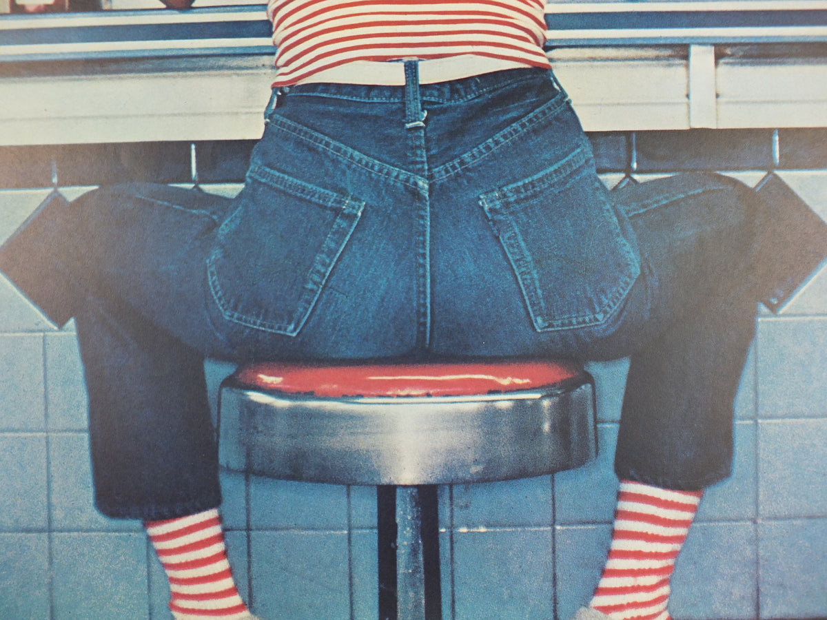 1980s Fiorucci rare Poster, Jeans spread on diner stool in red and white stripes, Italian fashion label, advertising retro wall art decor