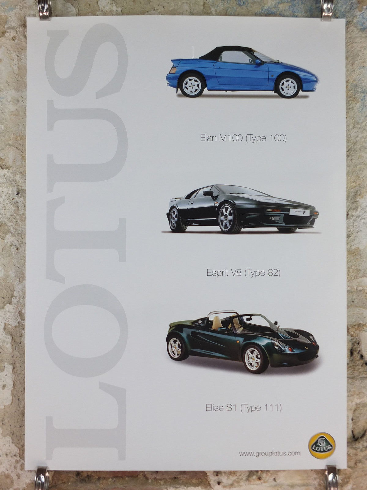 2000s Lotus Poster, showing the sports cars Elan M100, Esprit V8, Elise S1 hung in dealer showroom, Group Lotus sports, wall art decor