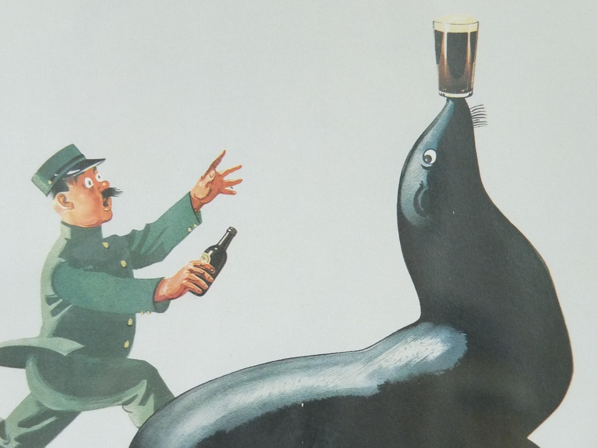 Hand signed 1981 John Gilroy Guinness Toucan Poster, Sea Lion 1935, Guinness Zookeeper with sea lion with pint on nose, wall art retro decor